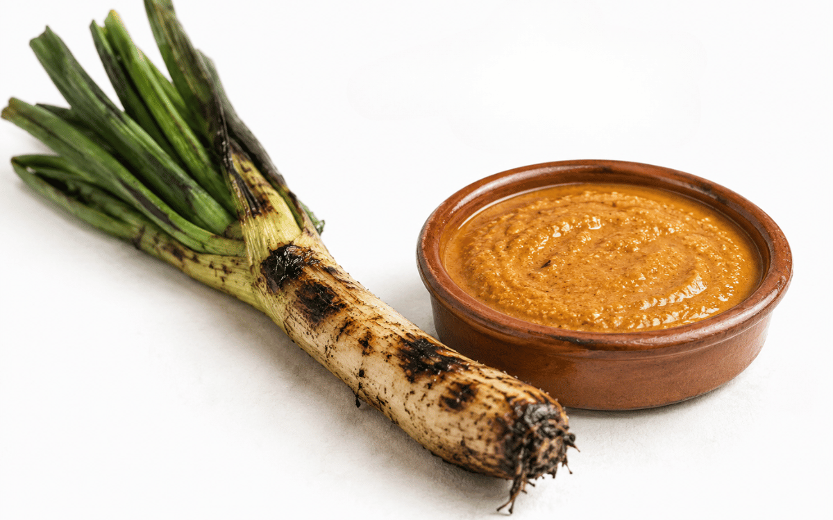 Calçots a la brasa cocinándose en restaurante de calçots en Sabadell